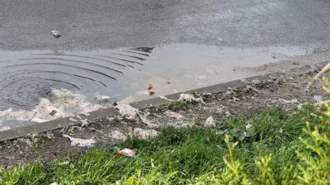 Alaina Gallacher Waste in flooding in Warwick Road, Whetstone, Leicestershire