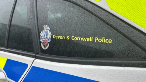 The side of a Devon and Cornwall Police vehicle