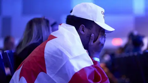 A Conservative Party supporter reacts to the projection of a Liberal government at the Conservative election party at the Rogers Centre in Ottawa, Ontario on April 28,