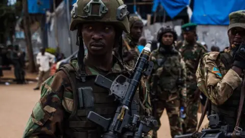 Getty Images M23 rebel soldiers in military uniform holding rifles in Bukavu, eastern DR Congo in February 2025