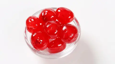 A bowl of maraschino cherries