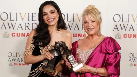 PA Media Rachel Zegler and Elaine Paige with their trophies at the Olivier Awards