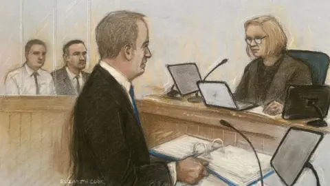 Elizabeth Cook/PA Ray Tully, shown wearing a dark suit and a blue tie in court in a sketch, presenting his case to the judge. Mr Tolliver and Mr Riley are shown in the background. 