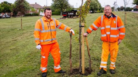 Council workers Jack Egholm (left) and Andy Robertson with some newly planted trees in Saltburn