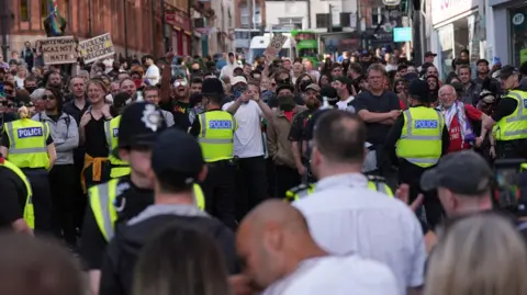 Protesters gathered near the Brian Clough statue in Nottingham