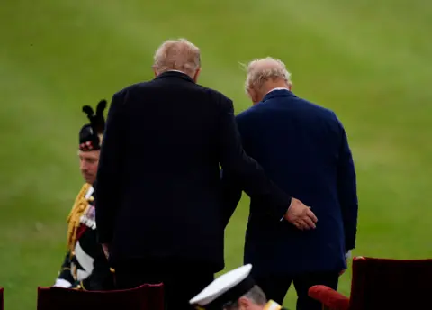 Jordan Pettitt/PA Wire US President Donald Trump and King Charles III look on during a Beating Retreat military ceremony at Windsor Castle, Berkshire, on day one of the president's second state visit to the UK. Picture date: Wednesday September 17, 2025. 
