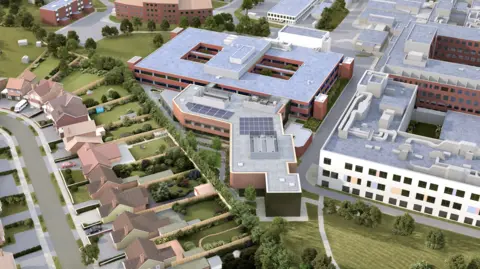 Kettering General Hospital An early-stage aerial artist’s impression of what the new building could look like and its location behind Rockingham Wing. It shows a number of buildings, a row of houses, with gardens, with grass areas around the buildings. 