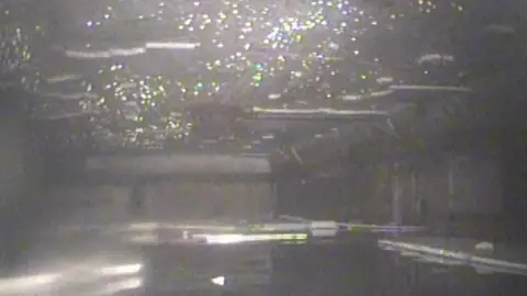 English Heritage/Star Geomatics A black and white image showing water inside a concrete structure