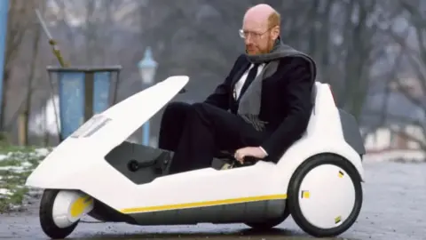 David Levenson Clive Sinclair is pictured in his Sinclair C5