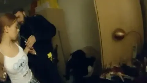 Met Police Bodyworn footage showing Summer Betts-Ramsey being put in handcuffs and led away from her home.