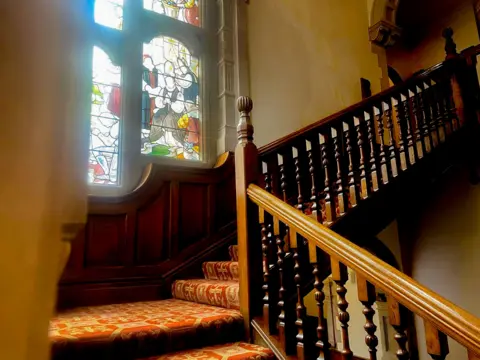 Stained-glass window on the Starway in Rainford Hall