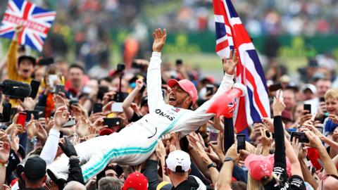 Race winner Lewis Hamilton of Great Britain and Mercedes GP celebrates with fans after the F1 Grand Prix of Great Britain at Silverstone on July 14, 2019