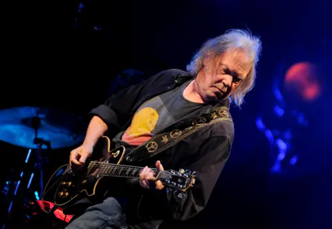 Neil Young performs on the Pyramid Stage at the Glastonbury Festival