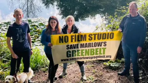 Joy Morrissey Campaigners with Joy Morrissey (second left) holding a banner