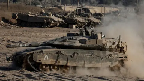 Reuters Israeli tank manoeuvres near the Israel-Gaza border (14 August 2024) 