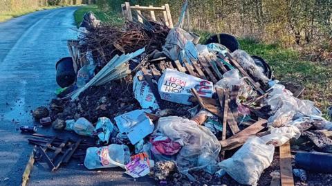 A large pile of fly-tipped rubbish