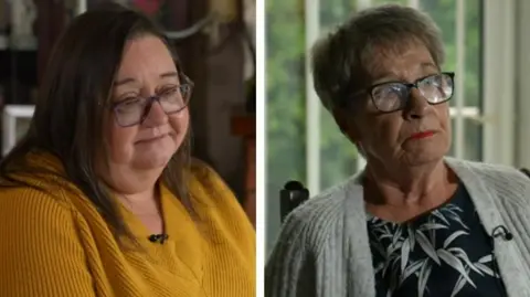  Maxine George is sat at home, wearing a yellow jumper and glasses. Jennifer Baiss is  sat in a chair at home, wearing a grey jumper and glasses. 