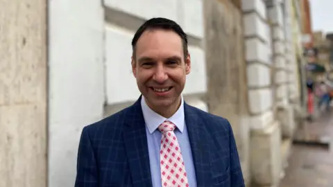 Councillor Dan Lister outside the Corn Exchange which forms part of the Greyfriars scheme