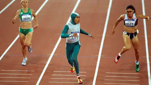 Getty Images Cathy Freeman crosses the finish line of a race