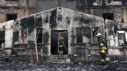 Evrim Aydin/Anadolu Bolu A view of the blackened veranda at the entrance of a hotel badly damaged by fire in the Kartalakaya ski resort.