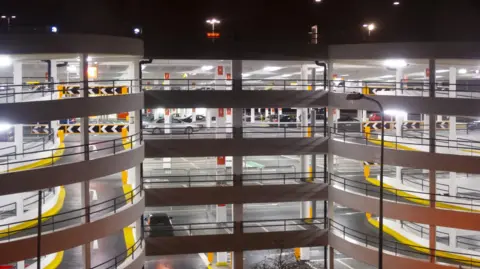 A night shot of a multi-storey car park