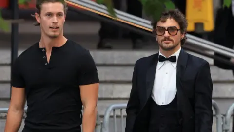 Getty Images US singer Benson Boone, right, arrives at Madison Square Garden