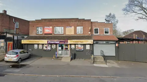 A general view picture of Hillside Stores, a two-storey building with a convenience store located on the first floor.