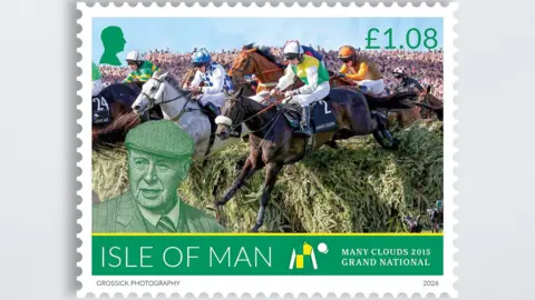 IOMPO A stamp featuring a shot of horses jumping a fence at the Grand National with Many Clouds in the fore. The horse has the number 2 on the saddle and the jockey is wearing Hemmings' white green and yellow colours.