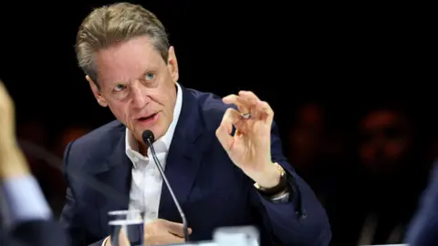 Getty Images Robert Friedland, founder of Ivanhoe Mines Ltd, speaks at a conference