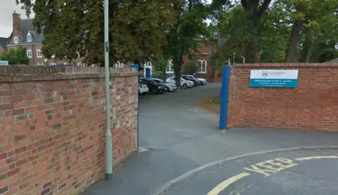 Google Bricked entrance to school with sign on one of the walls