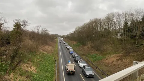 Ryan Kirkbride Large queue of vehicles pictured queuing on the A595