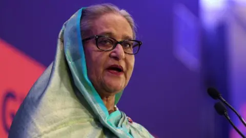 Reuters Then Prime Minister of Bangladesh Sheikh Hasina, in a teal saree, addresses the EU Global Gateway Forum 2023
