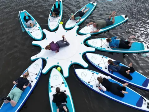 Arabella Love Yoga class on paddleboards