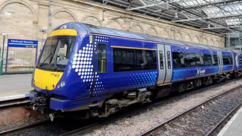 PA Media A Scotrail train at Edinburgh Waverley station