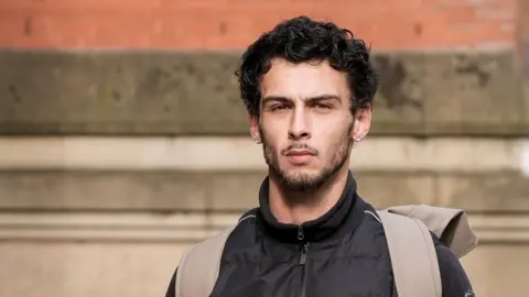 PA Media Defendant Jordan Wallace arriving at Minshull Street Magistrates' Court, Manchester.