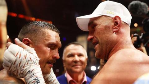 Tyson Fury embraces Oleksandr Usyk at the end of their fight