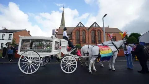 PA Media The white horse drawn carriage outside St John's Church in Birkdale