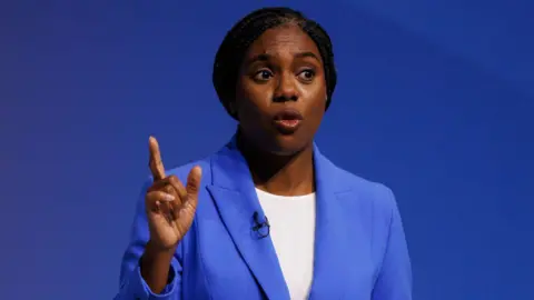 Getty Images Kemi Badenoch delivering her speech on the final day of the Conservative Party conference in Birmingham