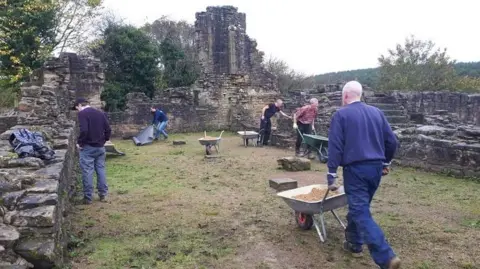 Dream Heritage A group of five volunteers working at the manor house.