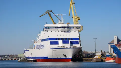 Brittany Ferries A large white ferry with Brittany Ferries branding on the side, and the word Islander on the bow.