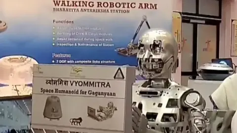 Screenshot from Doordarshan Isro's Vyommitra is a female humanoid