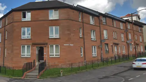 Google Block of red sandstone flats on Elmvale Street in Springburn