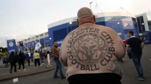 Adrian Webber/Getty Images Lee Jobber, faced away from the camera with a Leicester City tattoo on his back