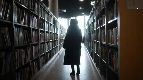 Getty Images Woman in a library
