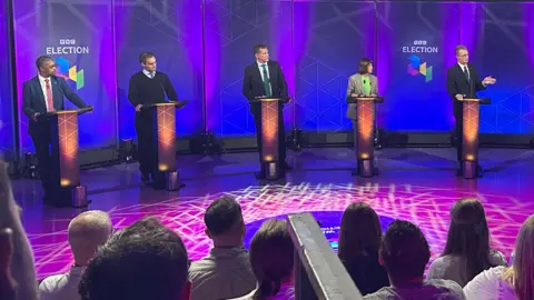 BBC The politicians at their podiums in the BBC Wales Election Debate