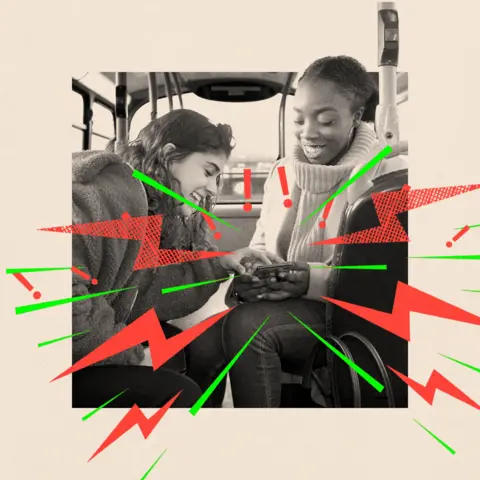 BBC Two teenage girls laugh as they look at a phone together. One wears a wite polo neck jumper and the other wears a darker fleece. The image is black and white and there are lightning bolts and exclamation marks coming out of the phone