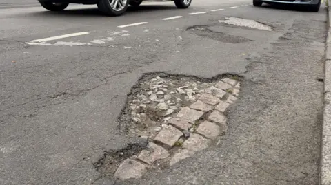 a2f9b280-493a-11f1-861c-270dbba6d6ae.jpg A pothole has burst my tyre - what now and how do I claim?