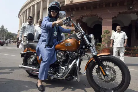 Getty Images Ranjeet Ranjan, Congress party MP from Supaul, Bihar and wife of Pappu Yadav arrives at Parliament House on her Harley Davidson bike