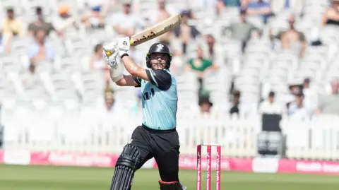 Sam Curran drives on the off side in Surrey's six wicket win over Middlesex 