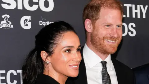 Duchess and Duke of Sussex, head and shoulders, in a pic in New York